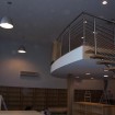 Retail Mezzanine with curved open edge timber clad fire protected columns and feature staircase